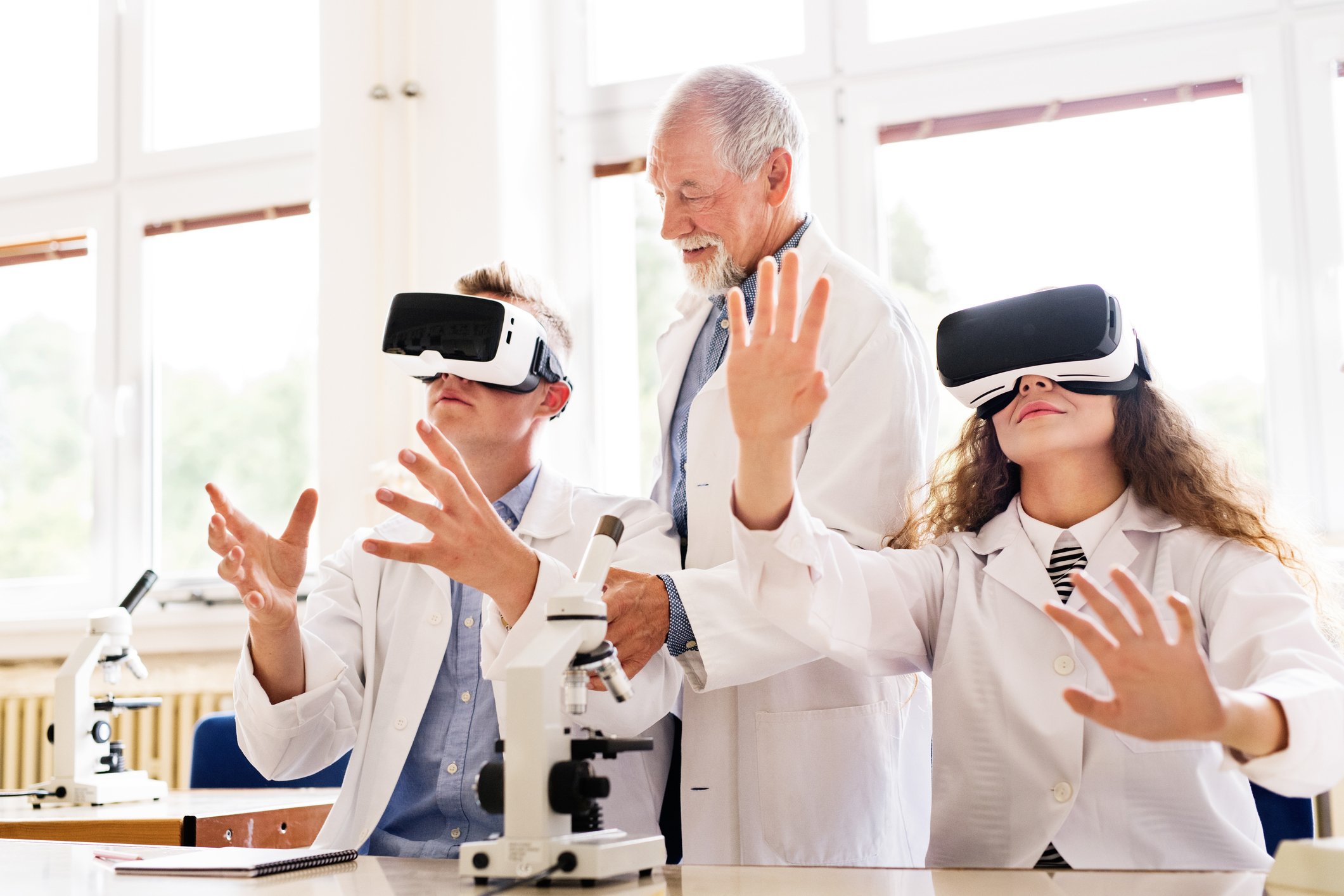 senior scientist teaching through VR